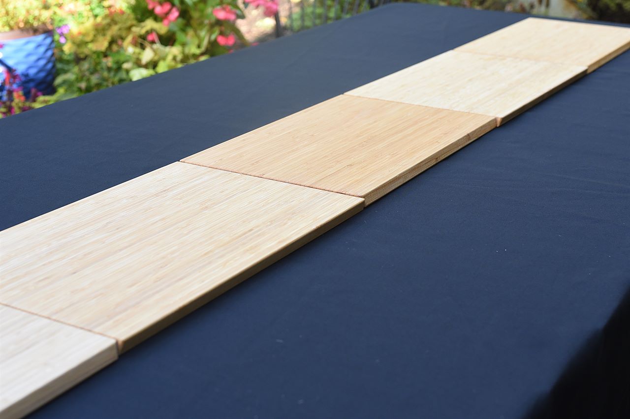 cutting boards lined up on a table