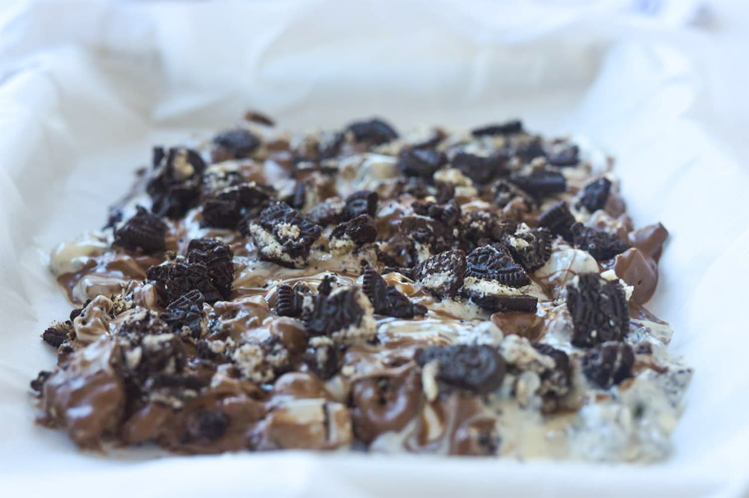cookies and cream bark on a baking sheet
