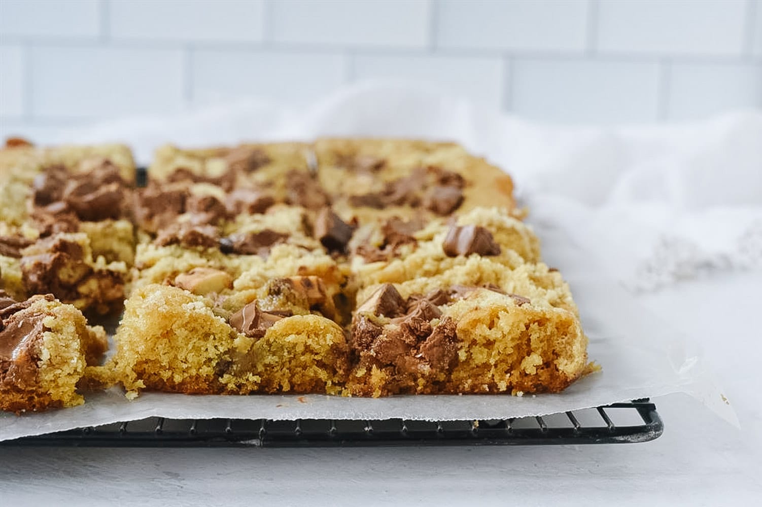 candy bar cake on cooling rack