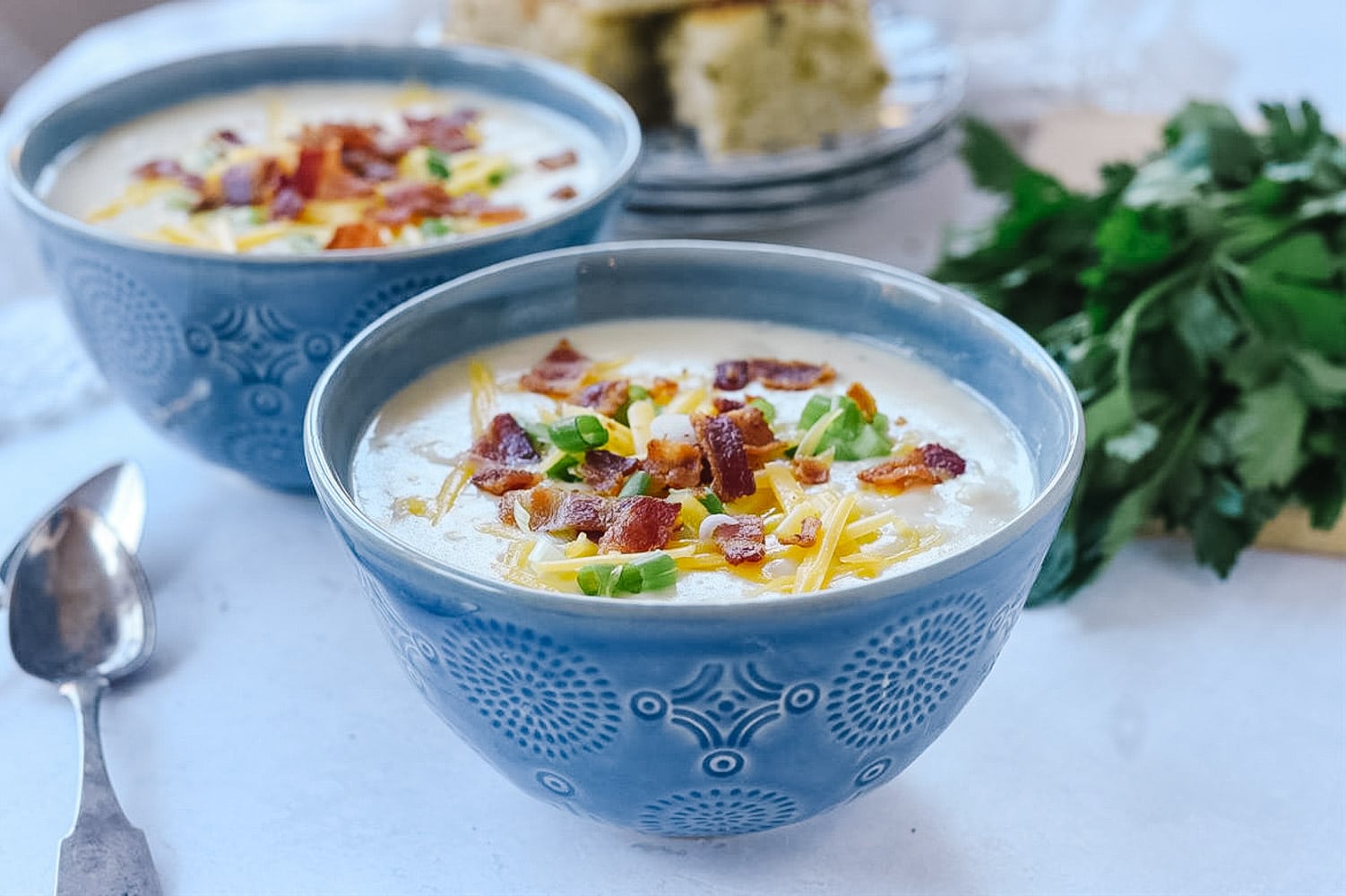 two bowls of instant pot potato soup