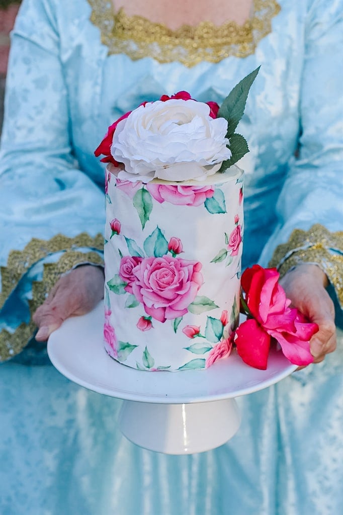 marie antoinette holding a cake