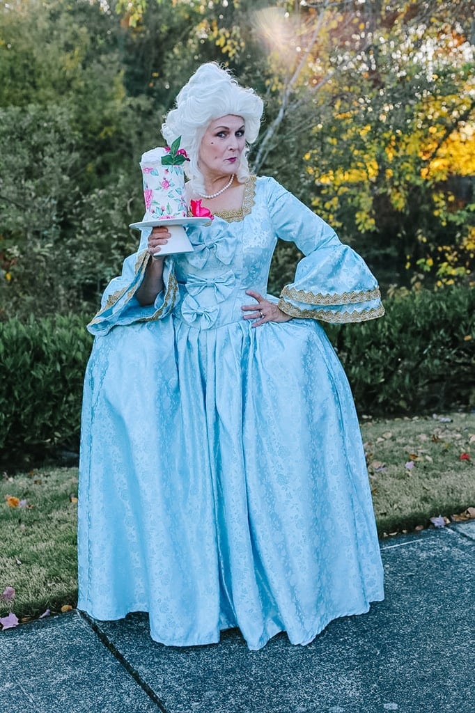 Marie Antoinette holding cake