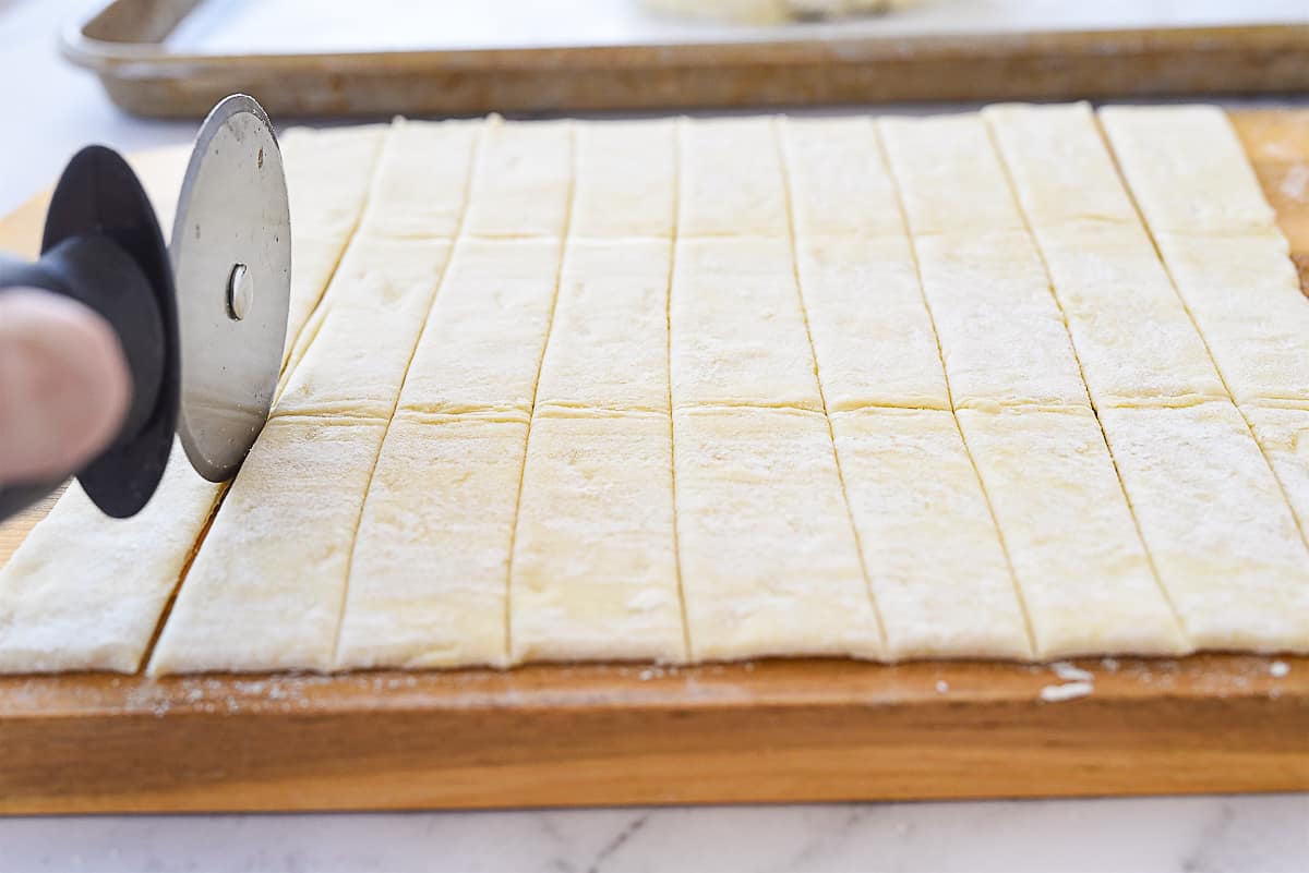 cutting puff pastry into strips