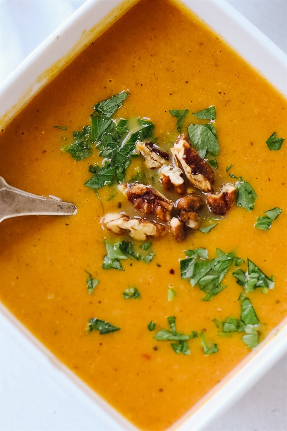 Single bowl of pumpkin vegetable soup