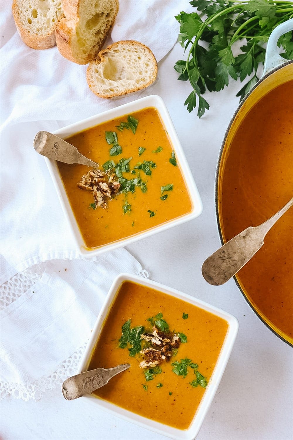 Two bowls of pumpkin vegetable soup