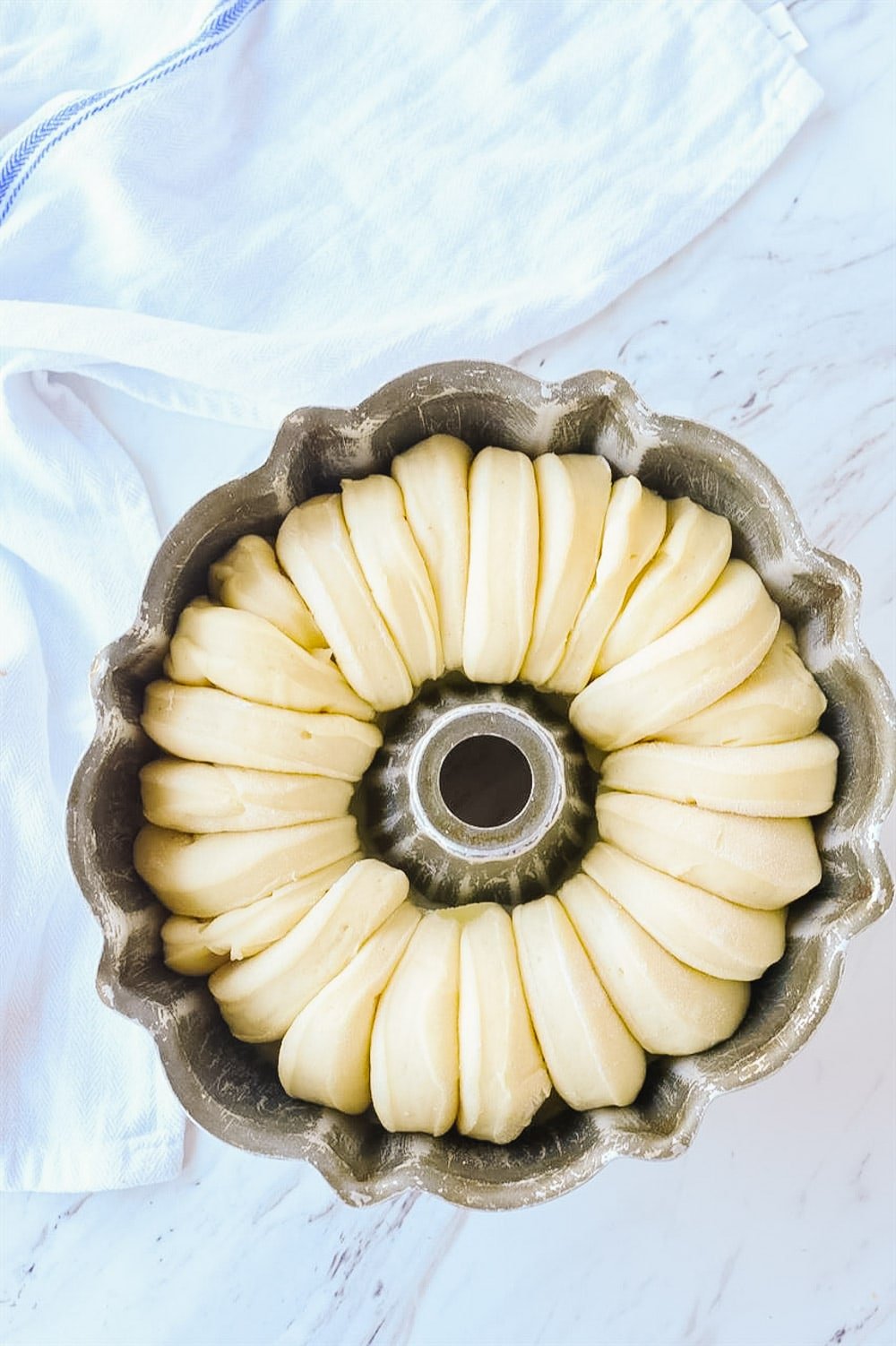 monkey bread rising in a pan