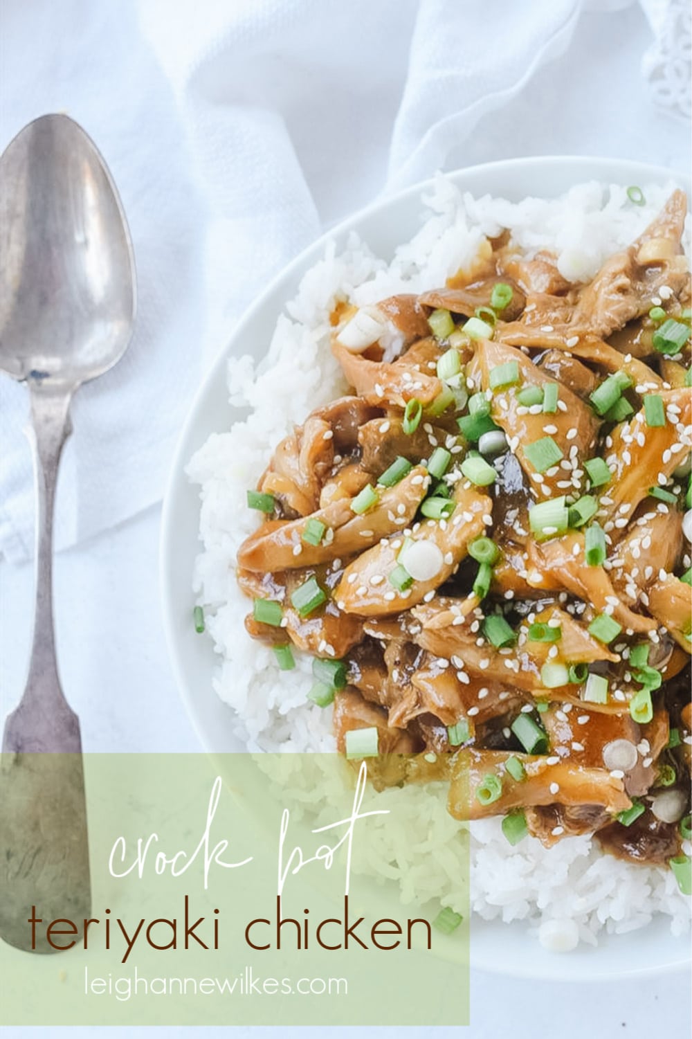 slow cooker teriyaki chicken in a bowl with a spoon