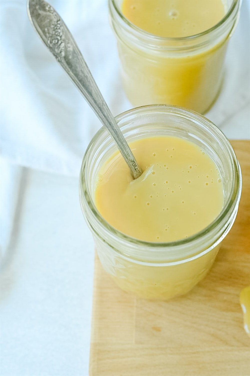 jar of dulce de leche with spoon in it