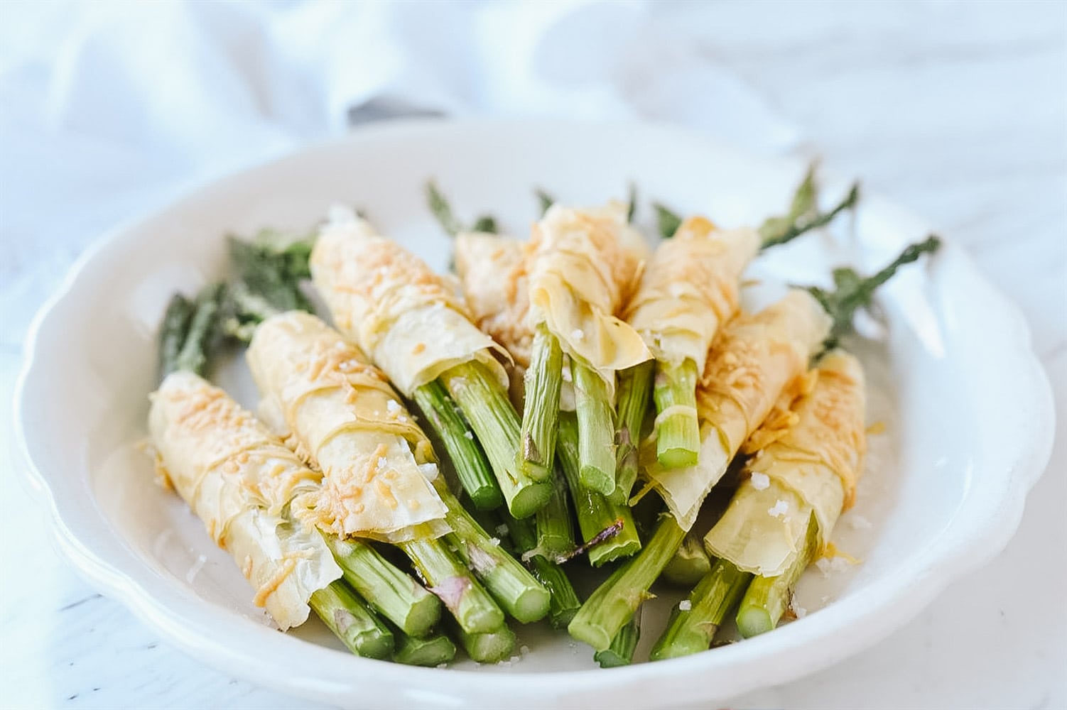 phyllo wrapped asparagus in a pile on a plate