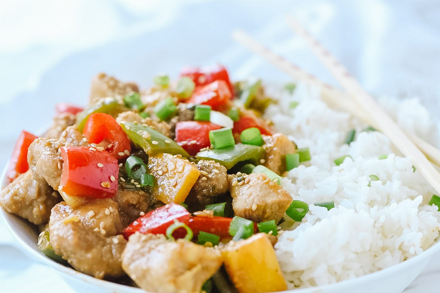 sweet and sour pork and rice in a bowl