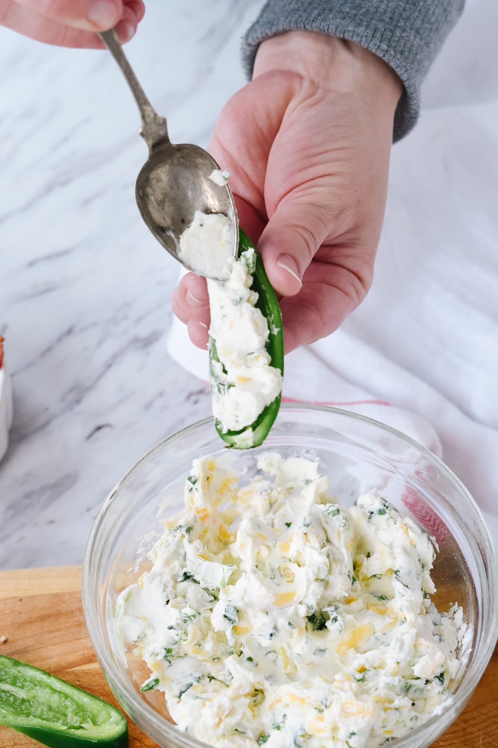 stuffing a jalapeno popper