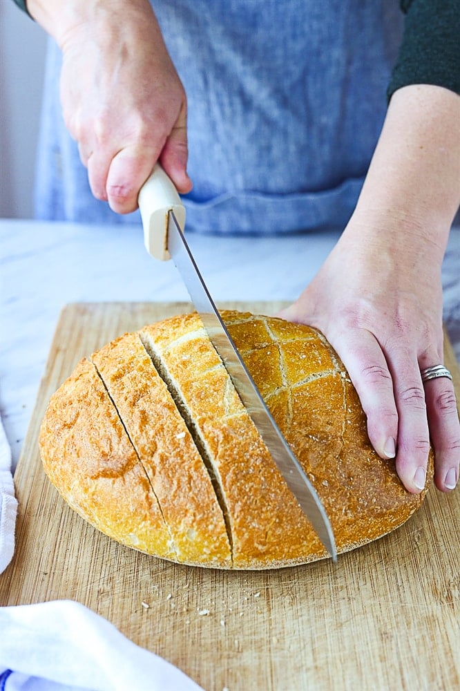 cutting a loaf of bread