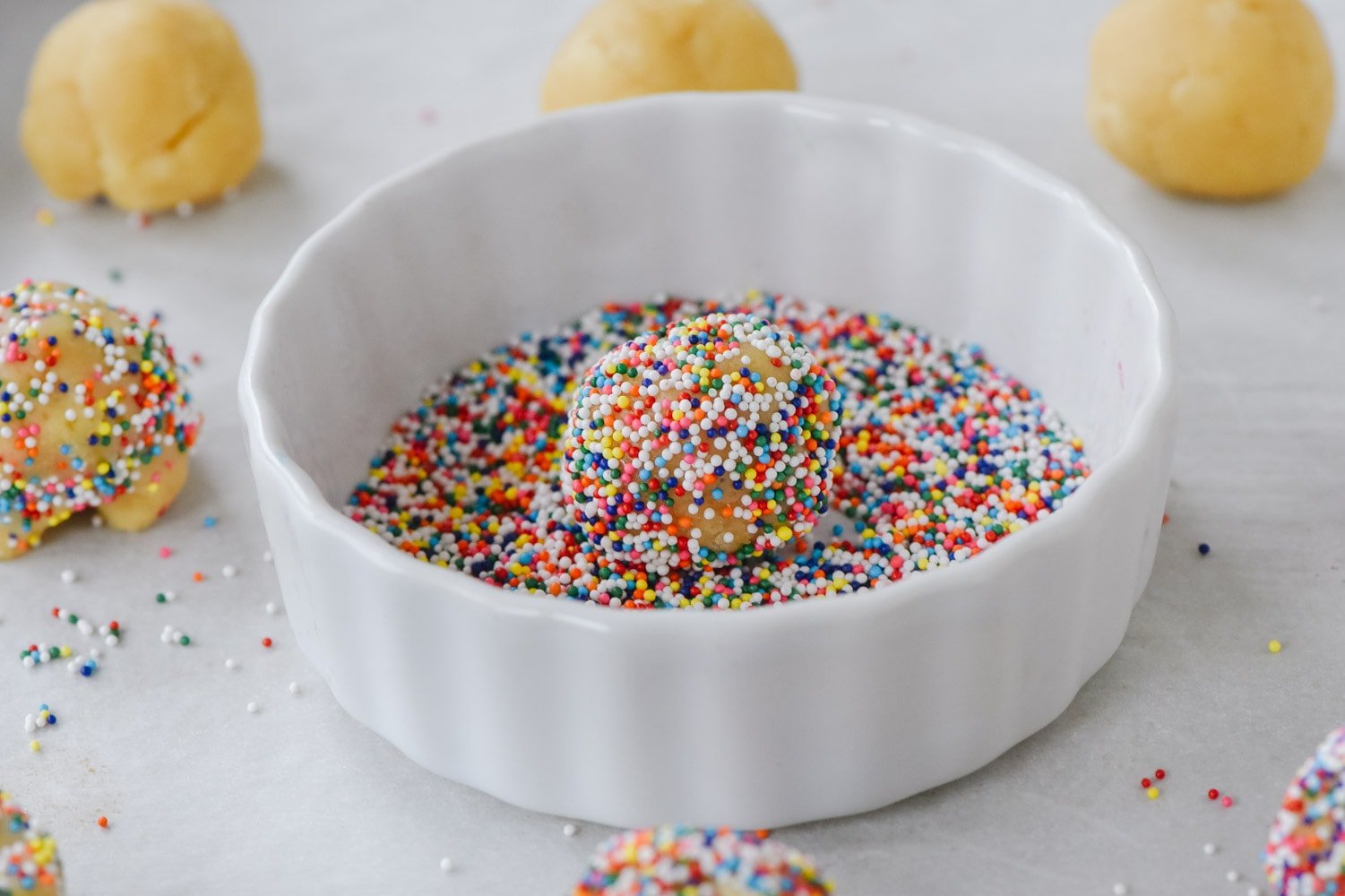 ball of sugar cookie dough with sprinkles