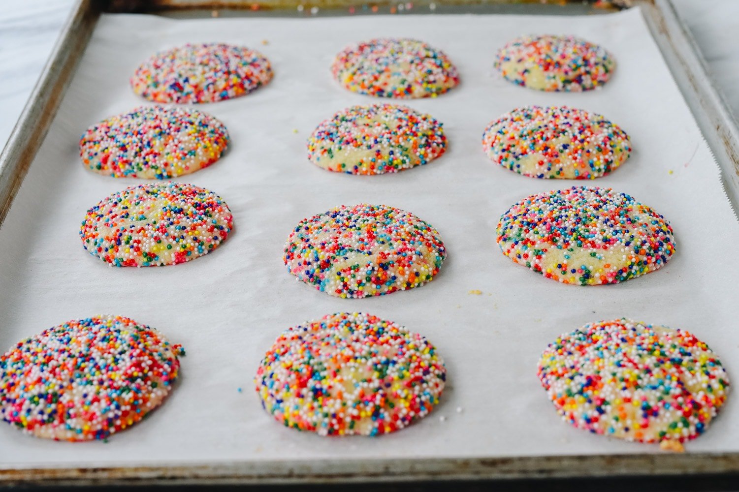 drop sugar cookies on baking sheet