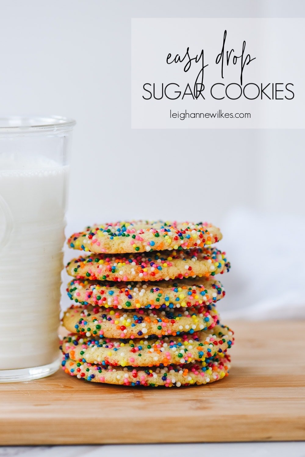 stack of sugar cookies and a glass of milk