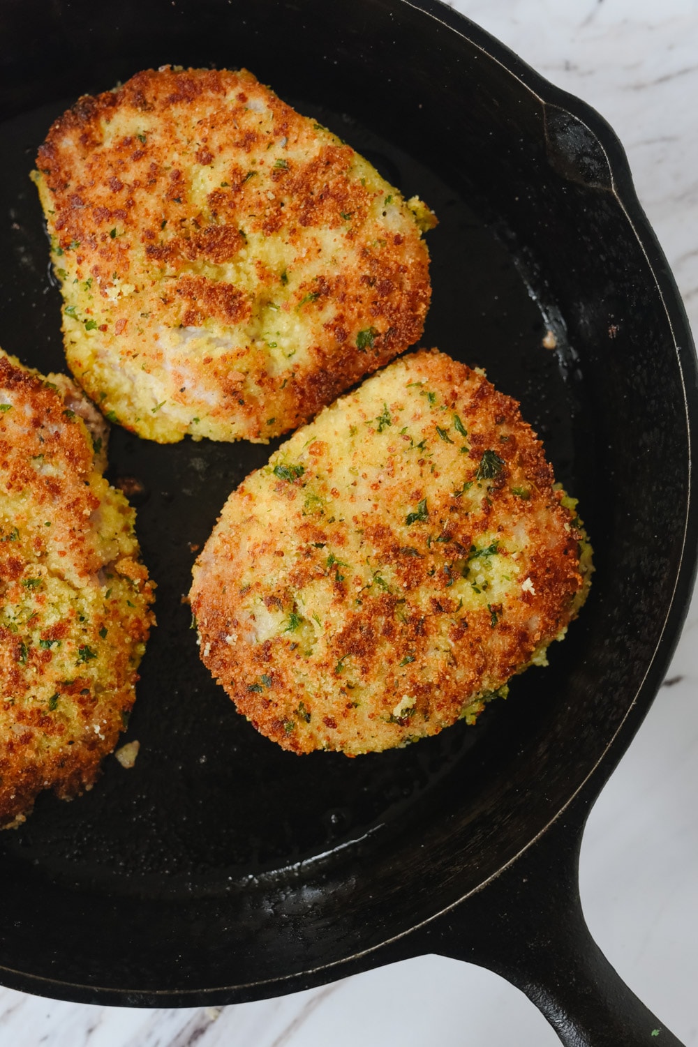 browned pork chops in pan