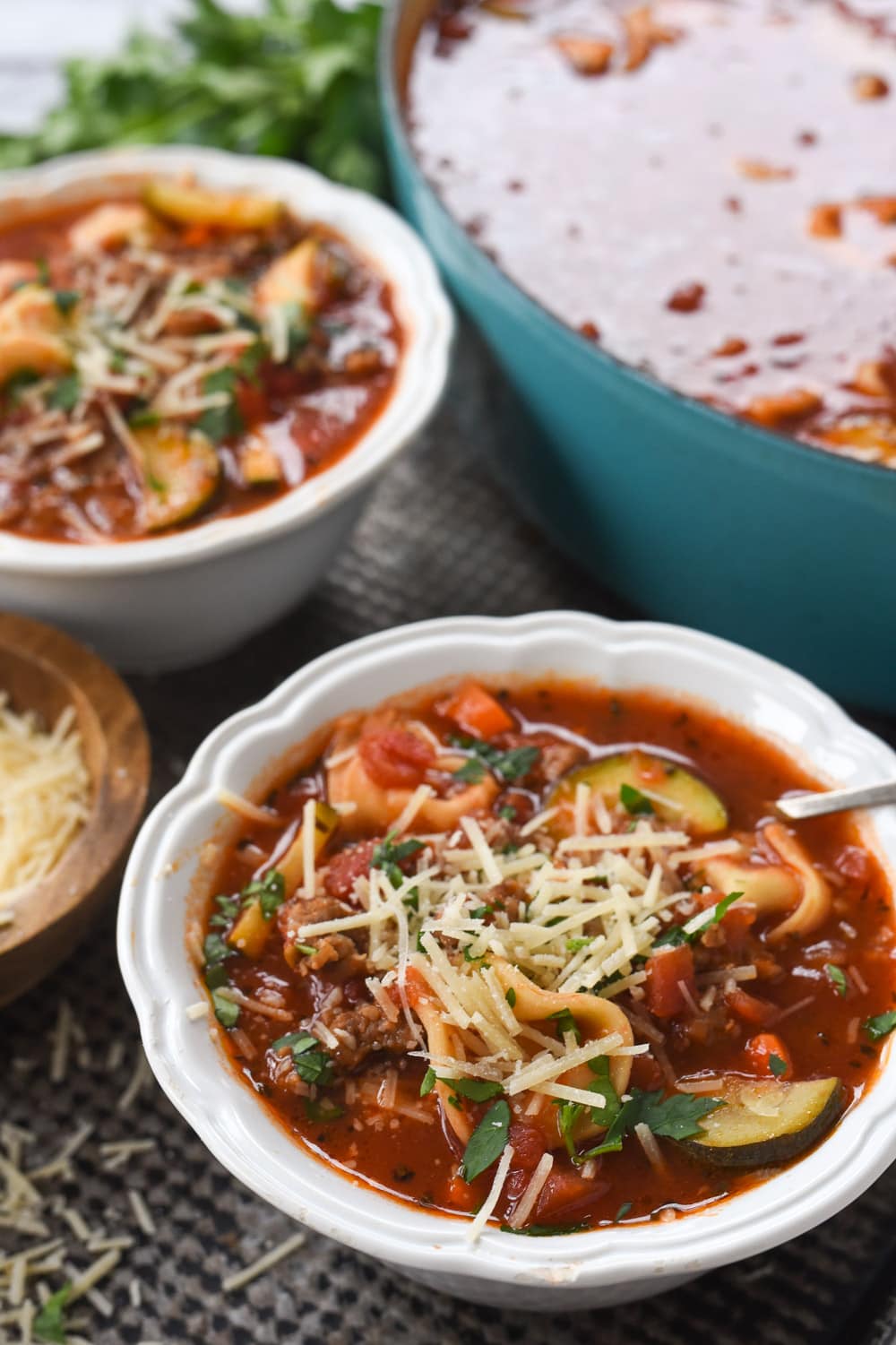 two bowls of sausage and tortellini soup