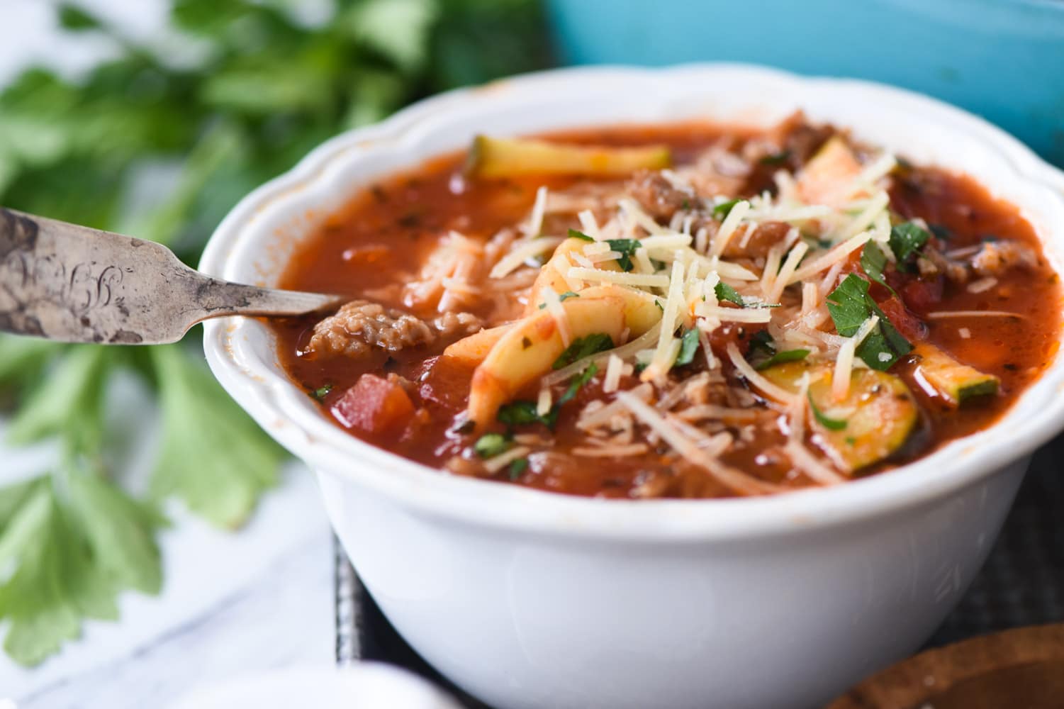 close up of a bowl of sausage tortellini soup