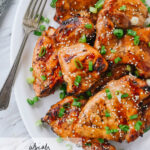 asian bbq chicken on a plate with a fork