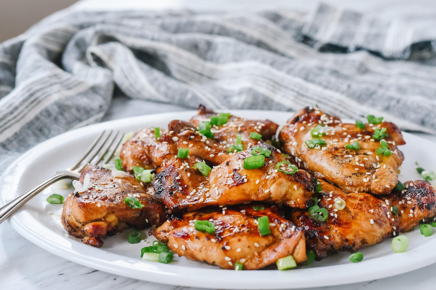 bbq chicken with green onion on it
