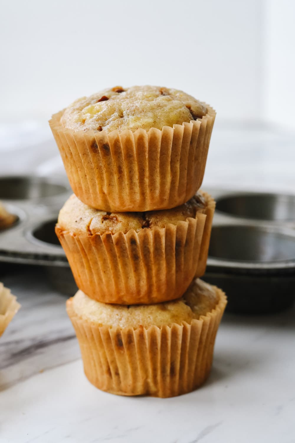 pile of banana cinnamon chip muffins