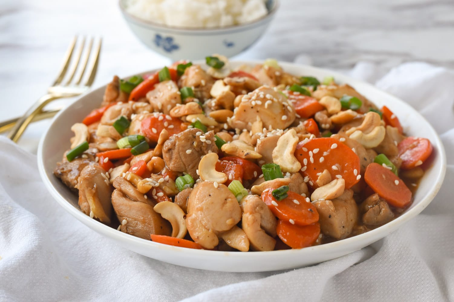 side view of a bowl of cashew nut chicken
