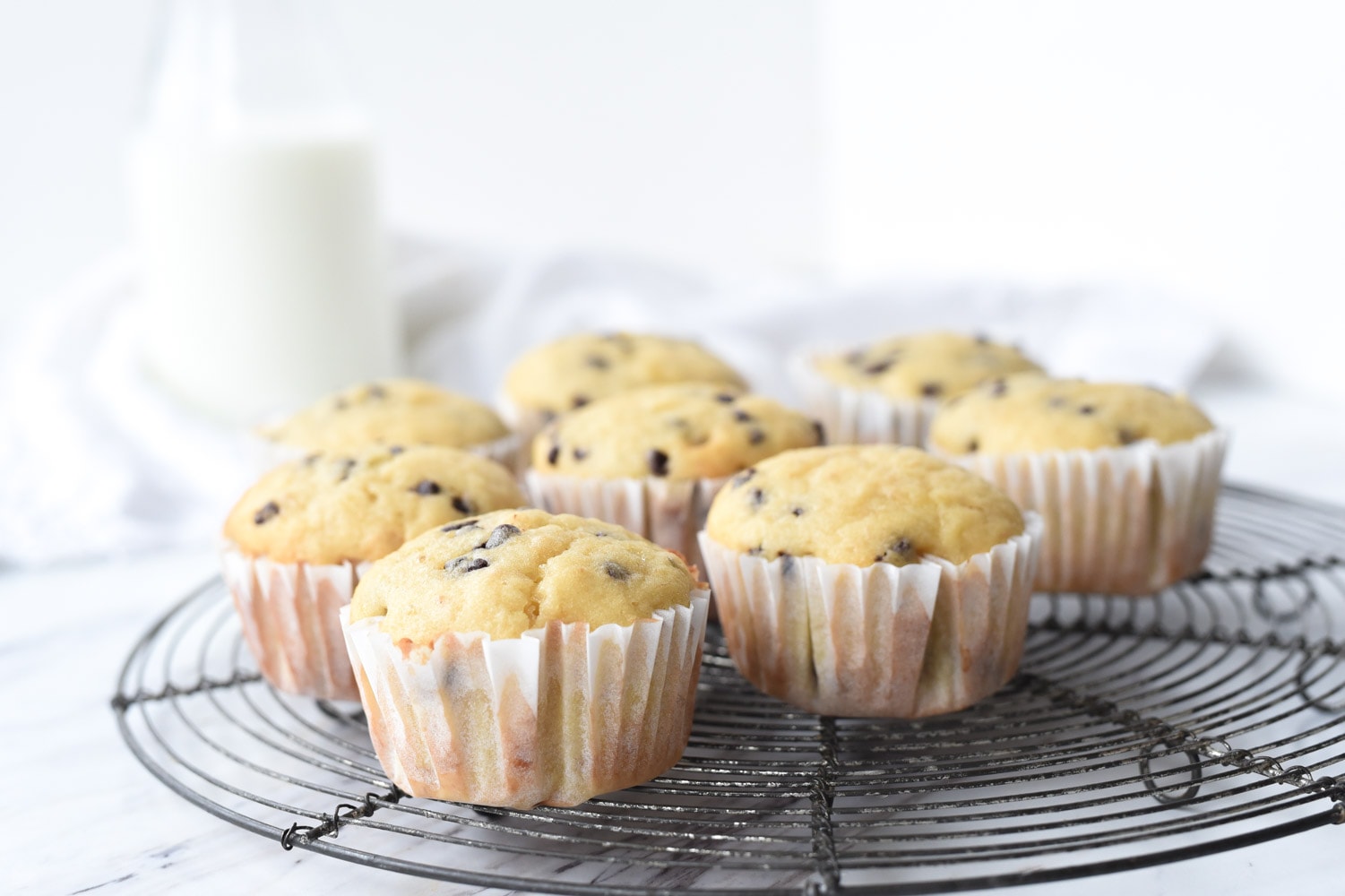 banana chocolate chip muffins on a cooling rack