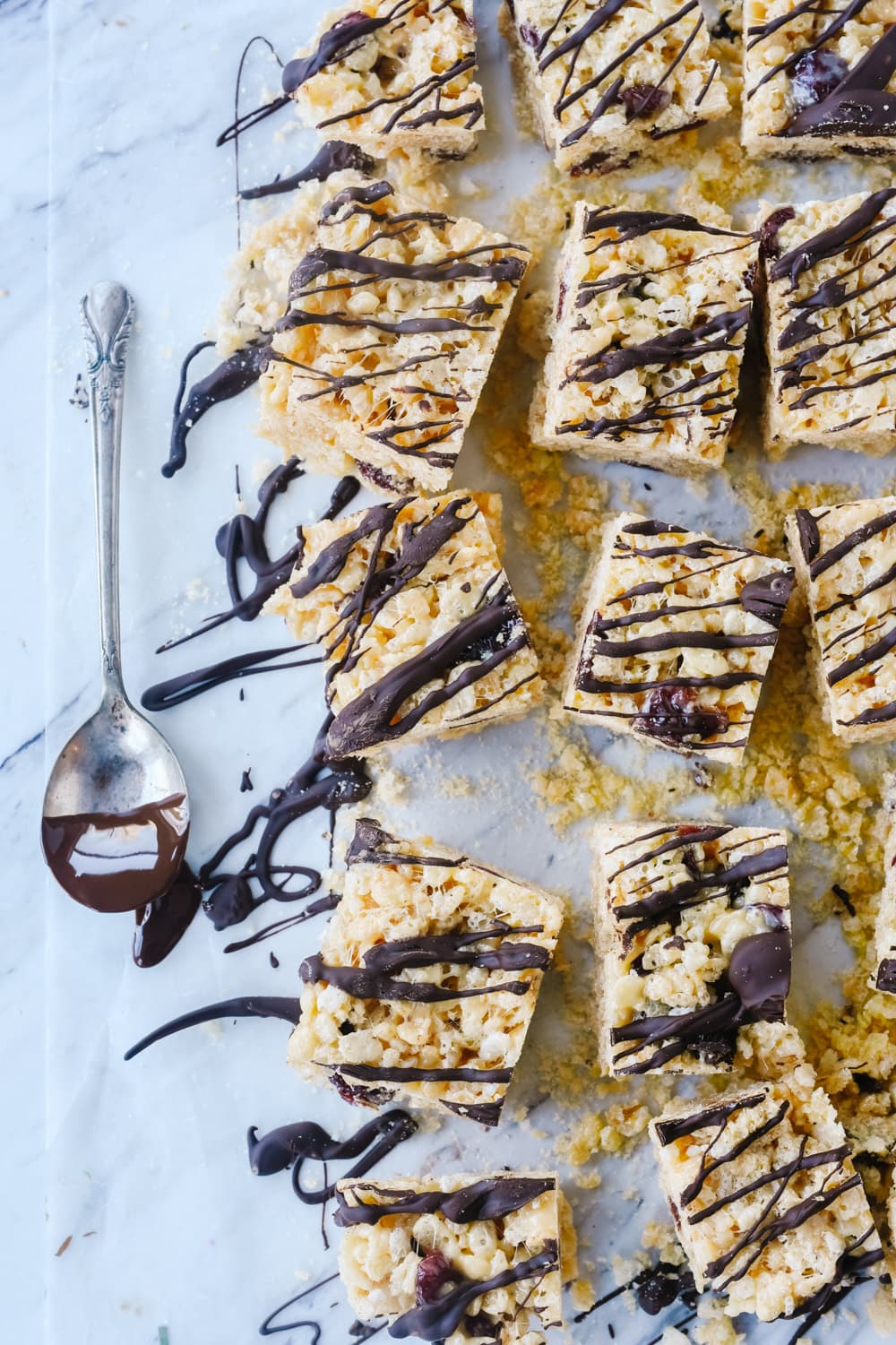 chocolate cherry rice krispie treats with chocolate drizzled on them