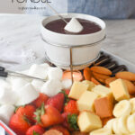 marshmallow dipping into chocolate fondue