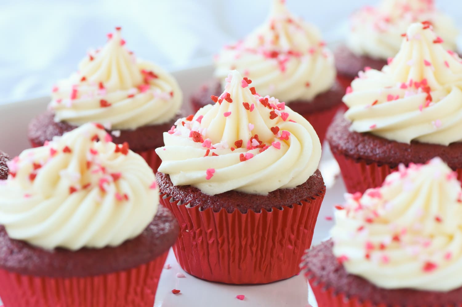 red velvet cupcakes with sprinkles on top