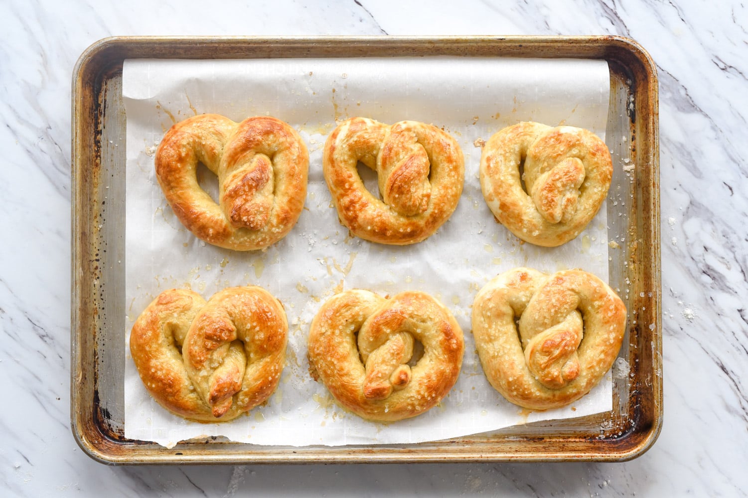 soft pretzels on a baking sheet