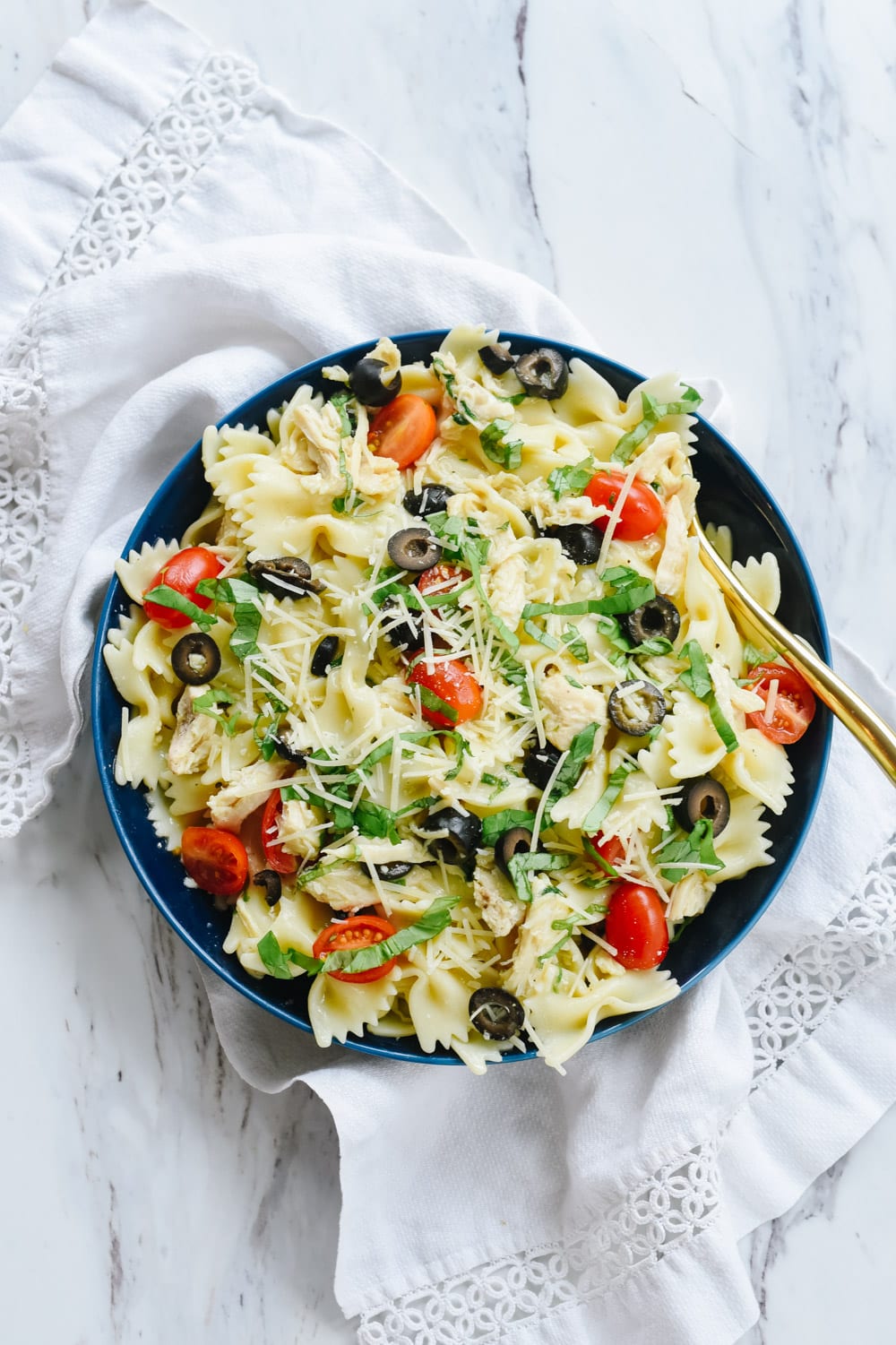 blue bowl of mediterranean chicken pasta