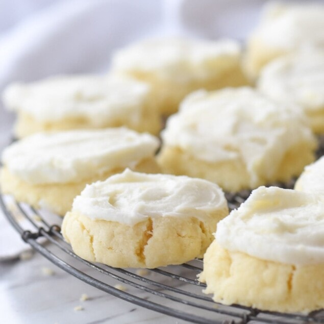 frosted cookies on a cooling rack