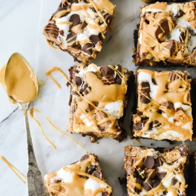 Peanut Butter Cheesecake brownies drizzled with peanut butter