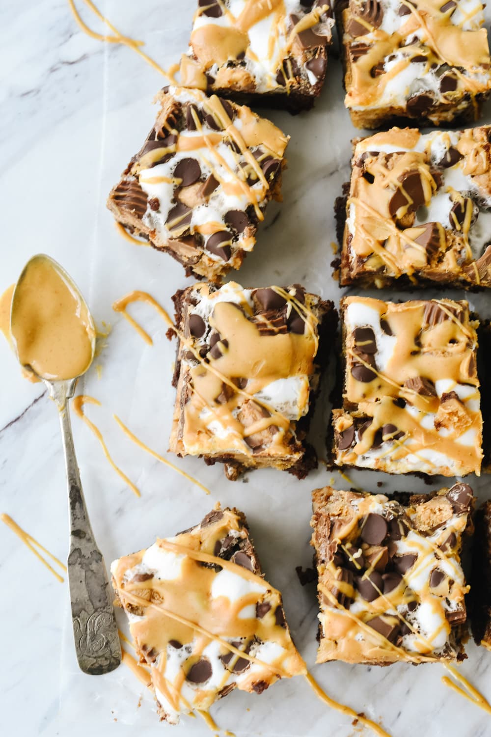 Peanut Butter Cheesecake brownies drizzled with peanut butter