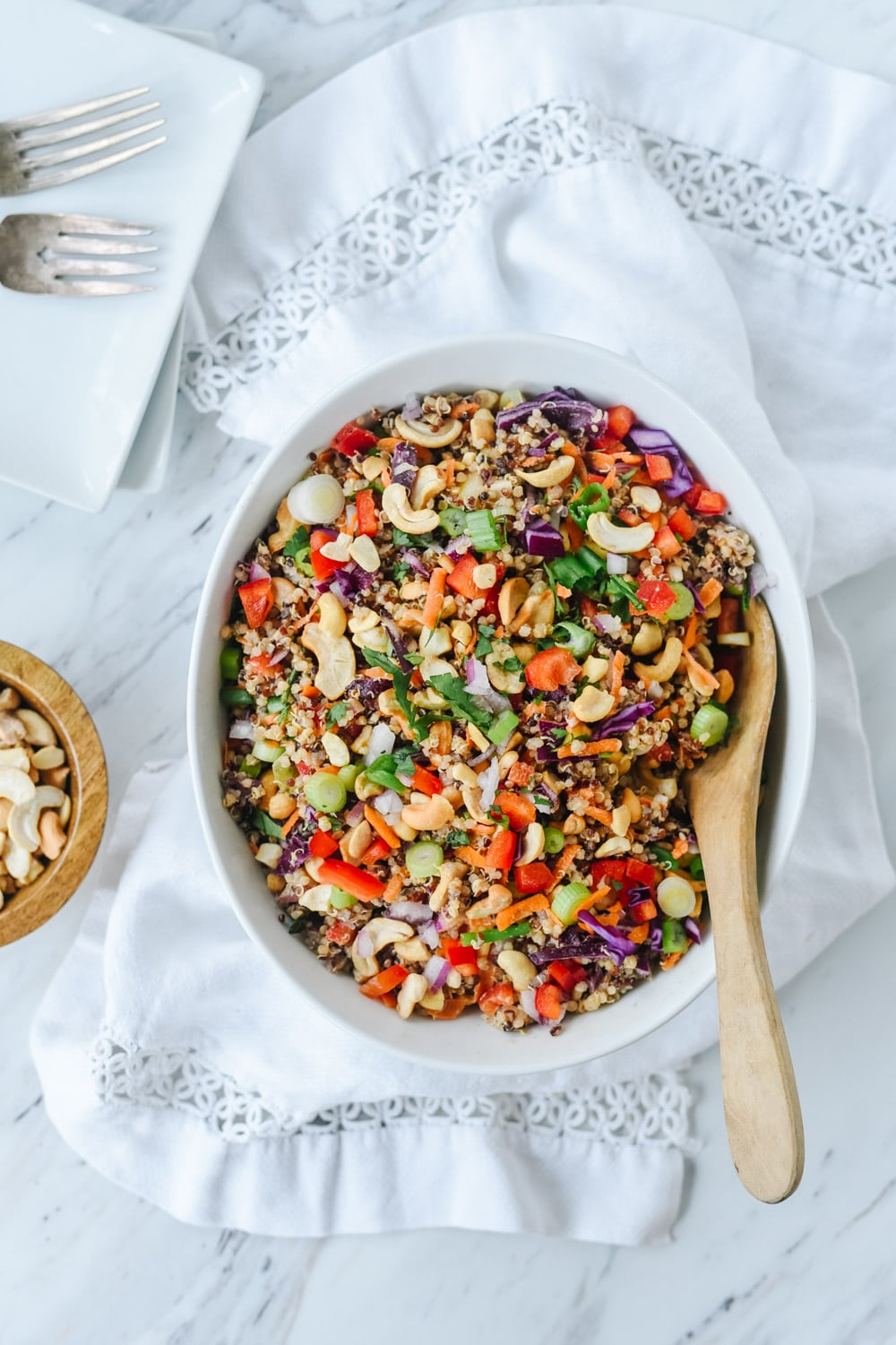 bowl of thai quinoa with wooden spoon