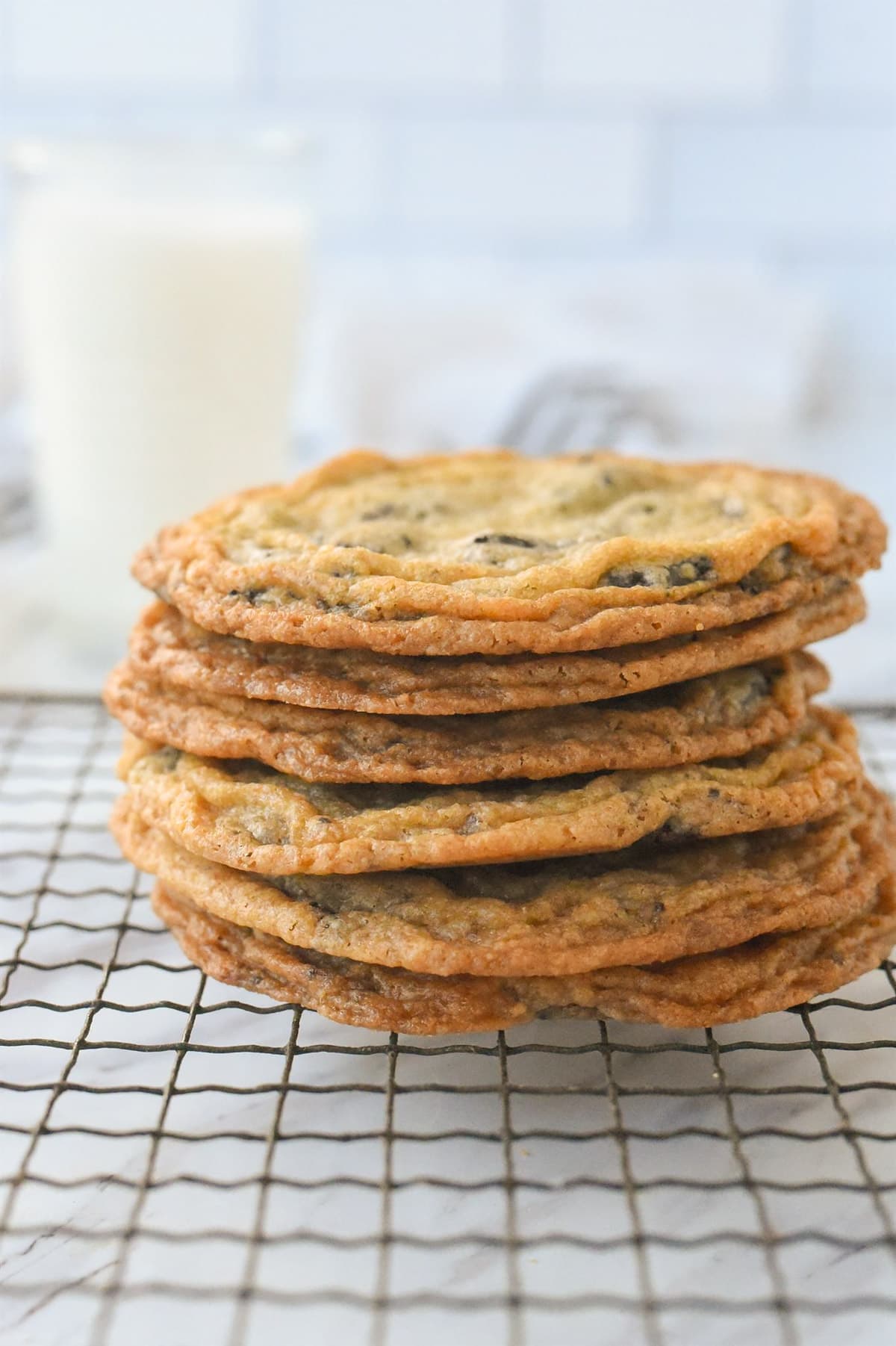 pile of cookies with a glass of milk