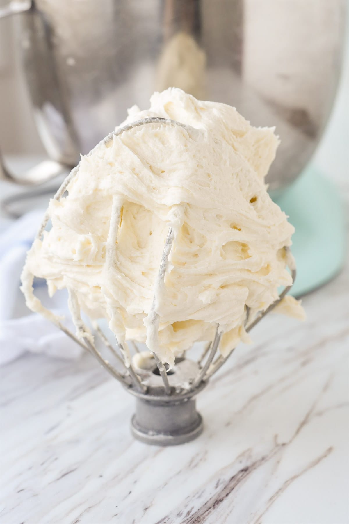 buttercream frosting on a whisk