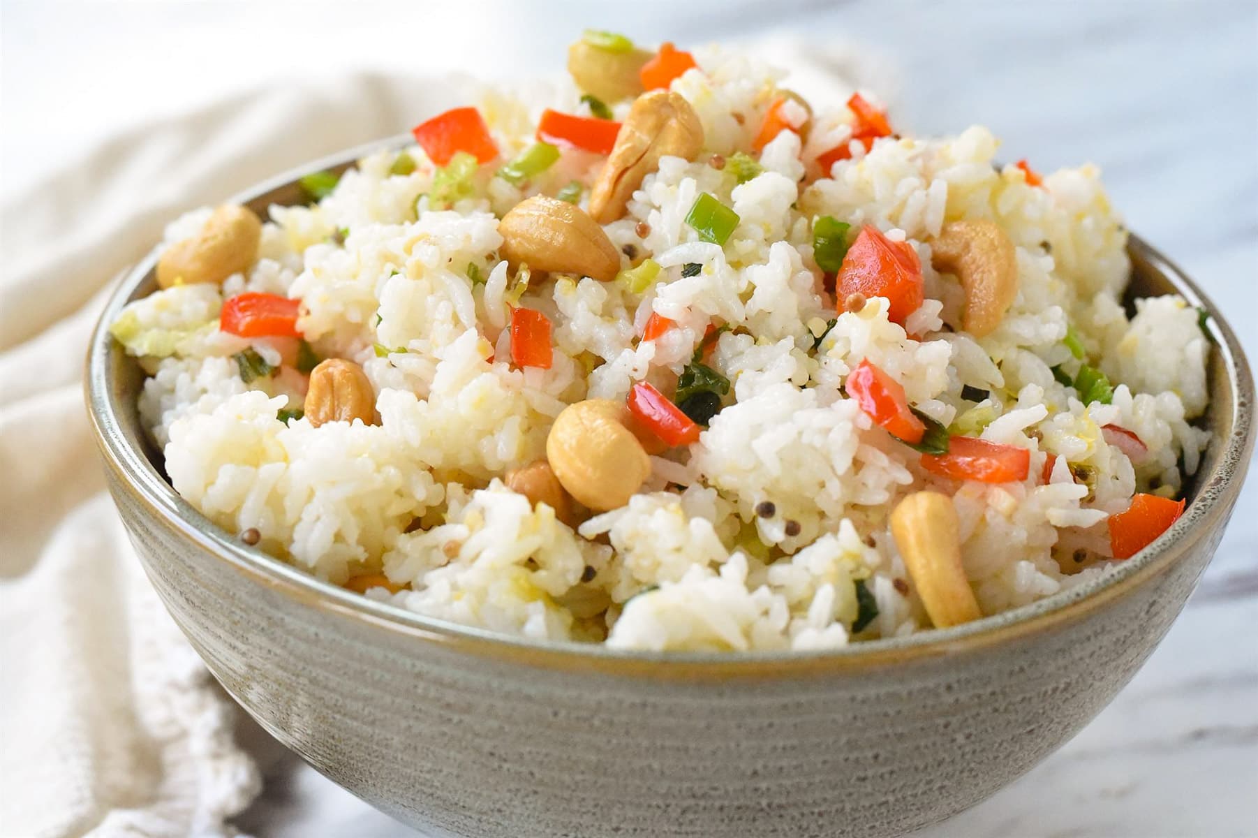 green bowl with cashew nut rice