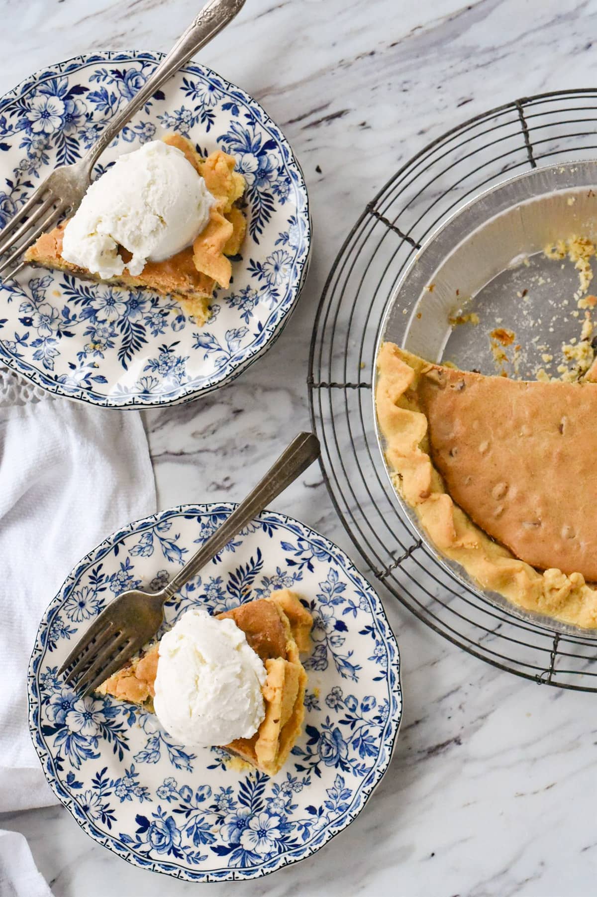 two slices of chocolate chip cookie pie on plates