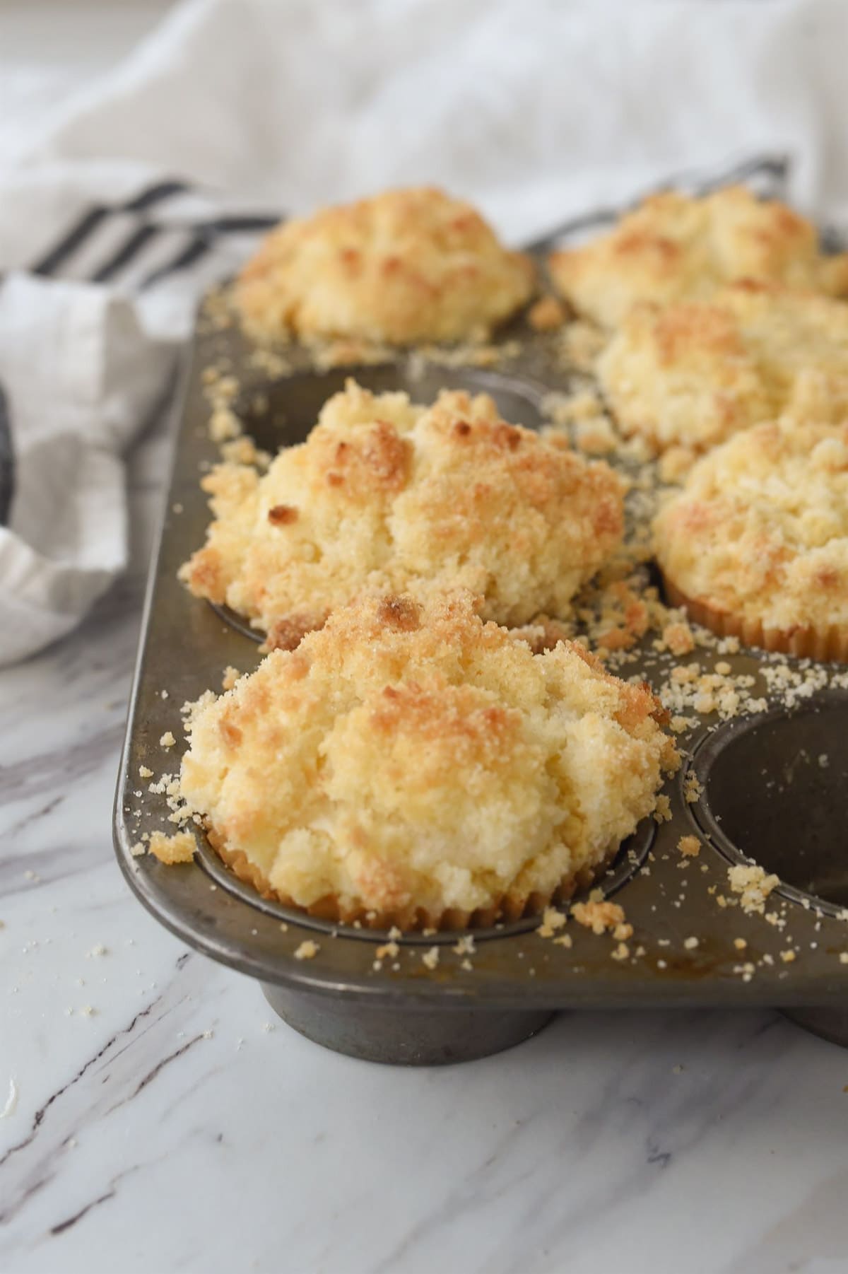 cream cheese muffins in a muffin tin