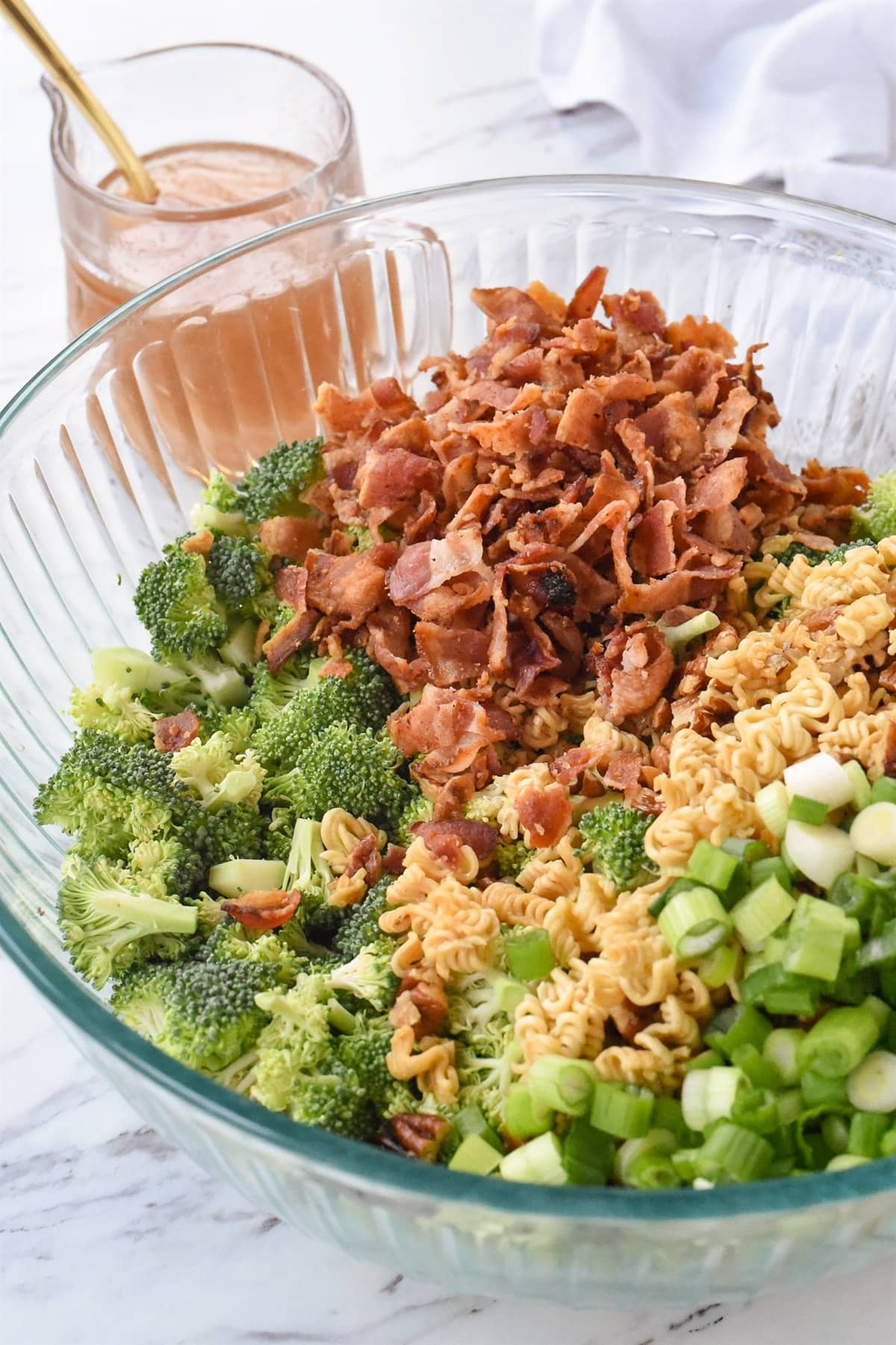 broccoli crunch salad ingredients in a bowl