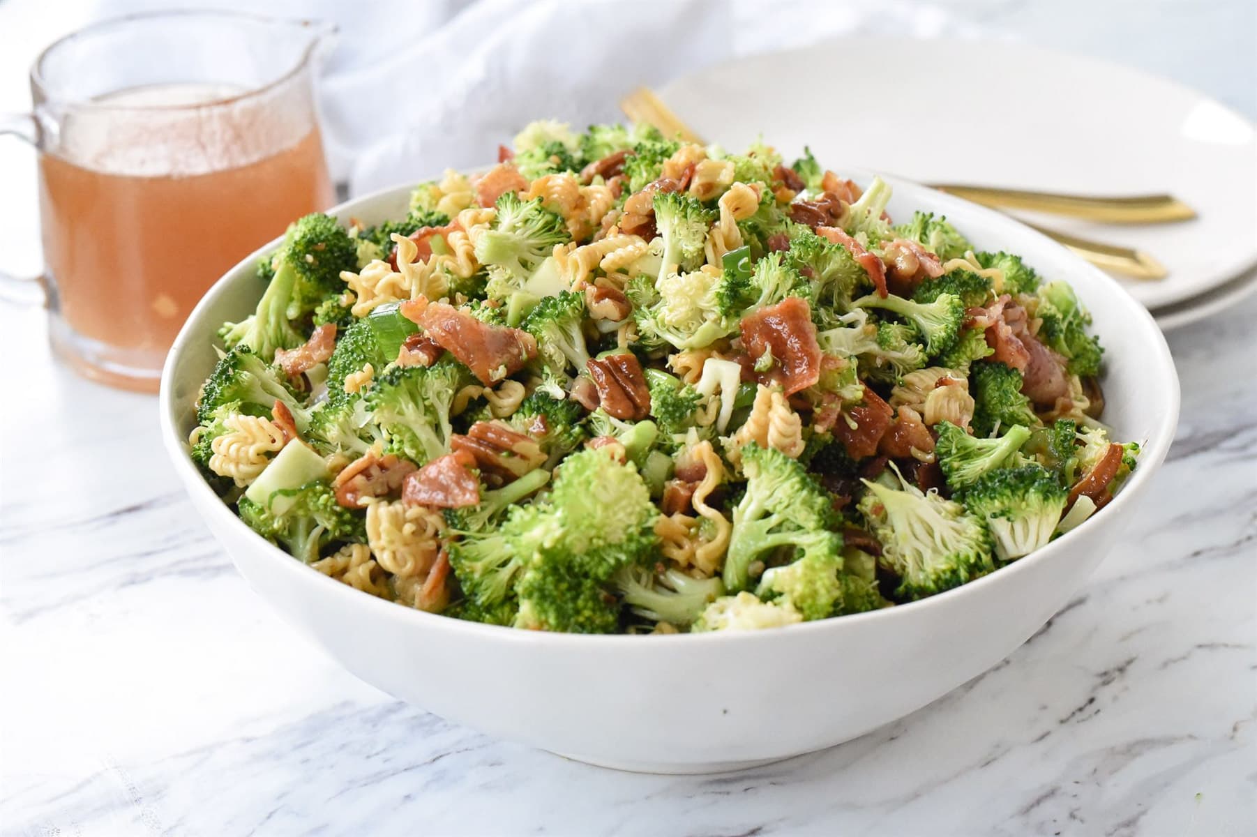 broccoli salad in a white bowl