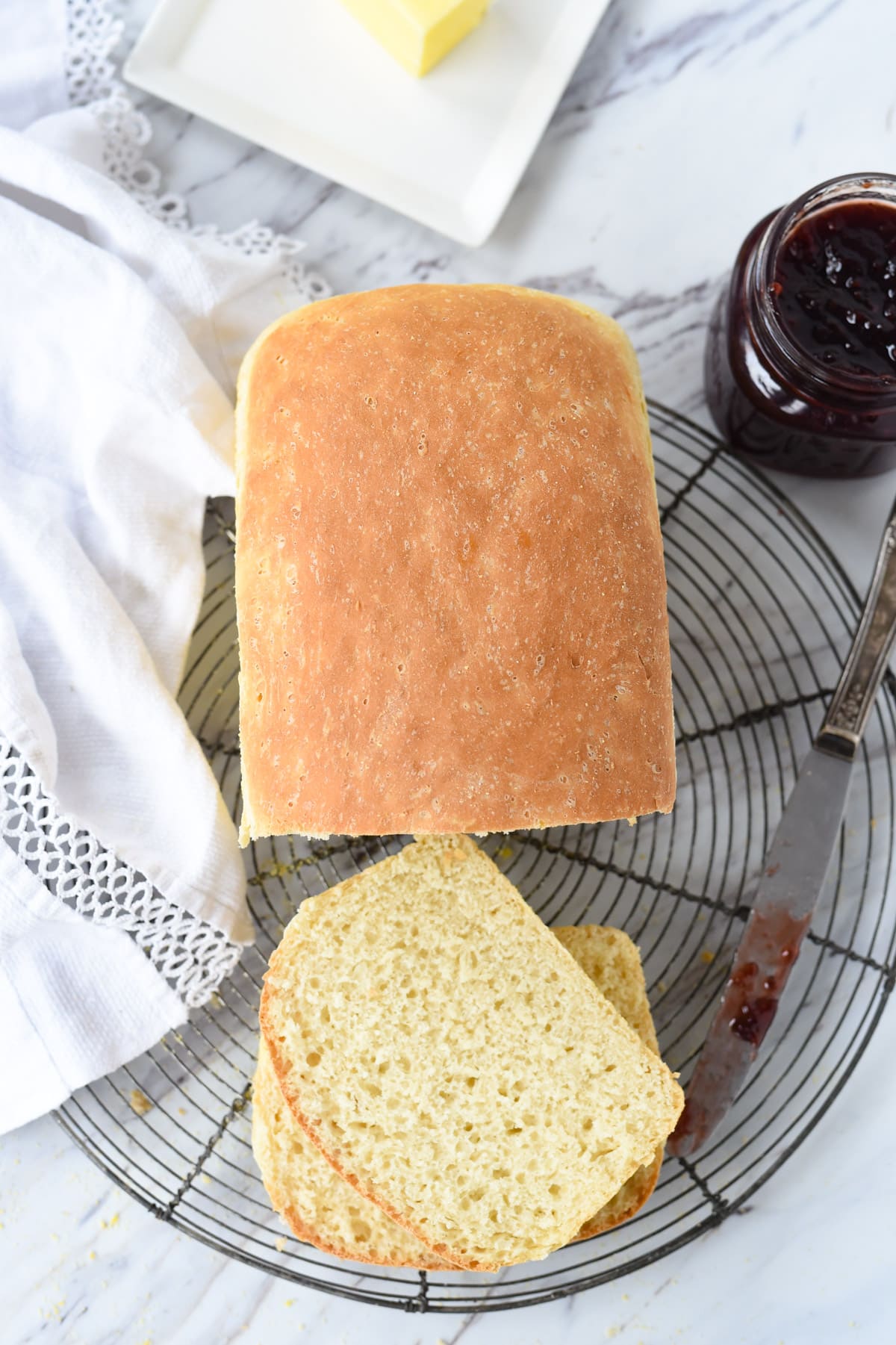 overhead shot of loaf of bread and slices of bread