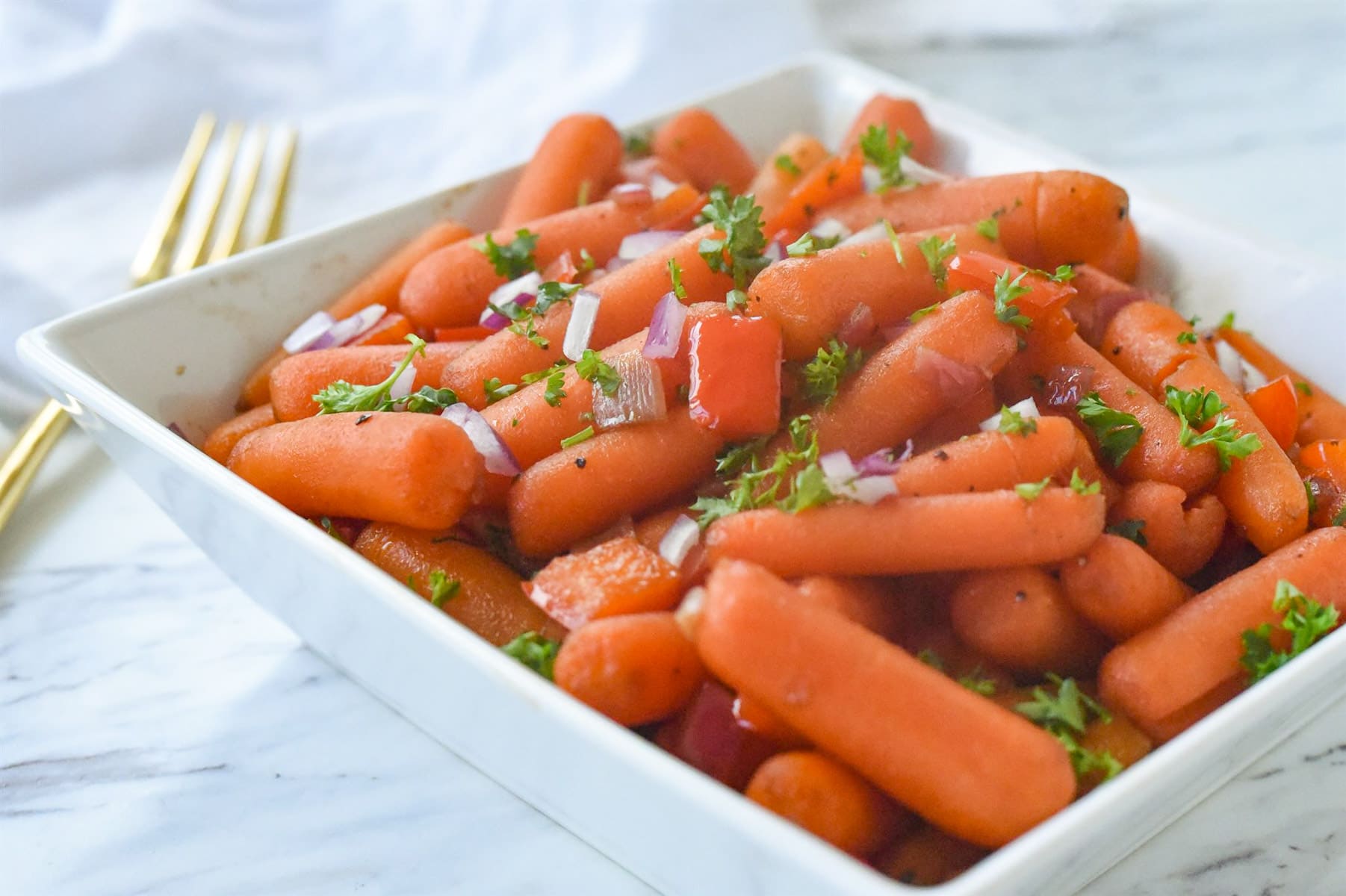  carrots in a white bowl