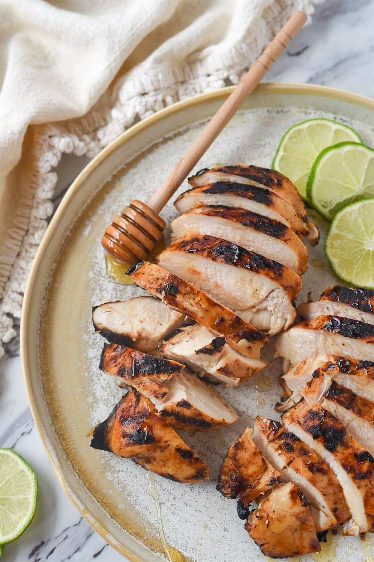 honey lime chicken with slices of lime