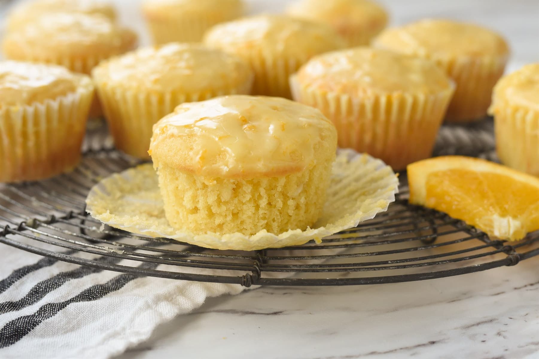 orange muffin with muffin wrapper pealed off