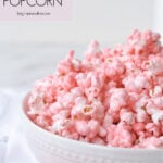 white bowl full of pink popcorn