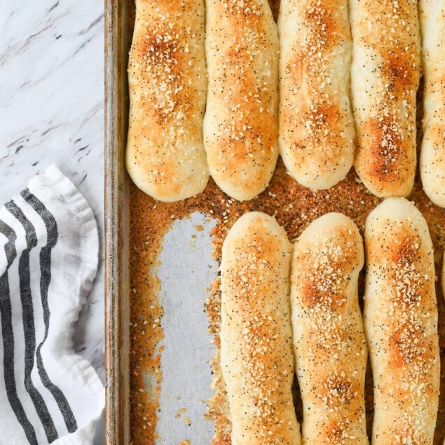 breadsticks on a baking sheet