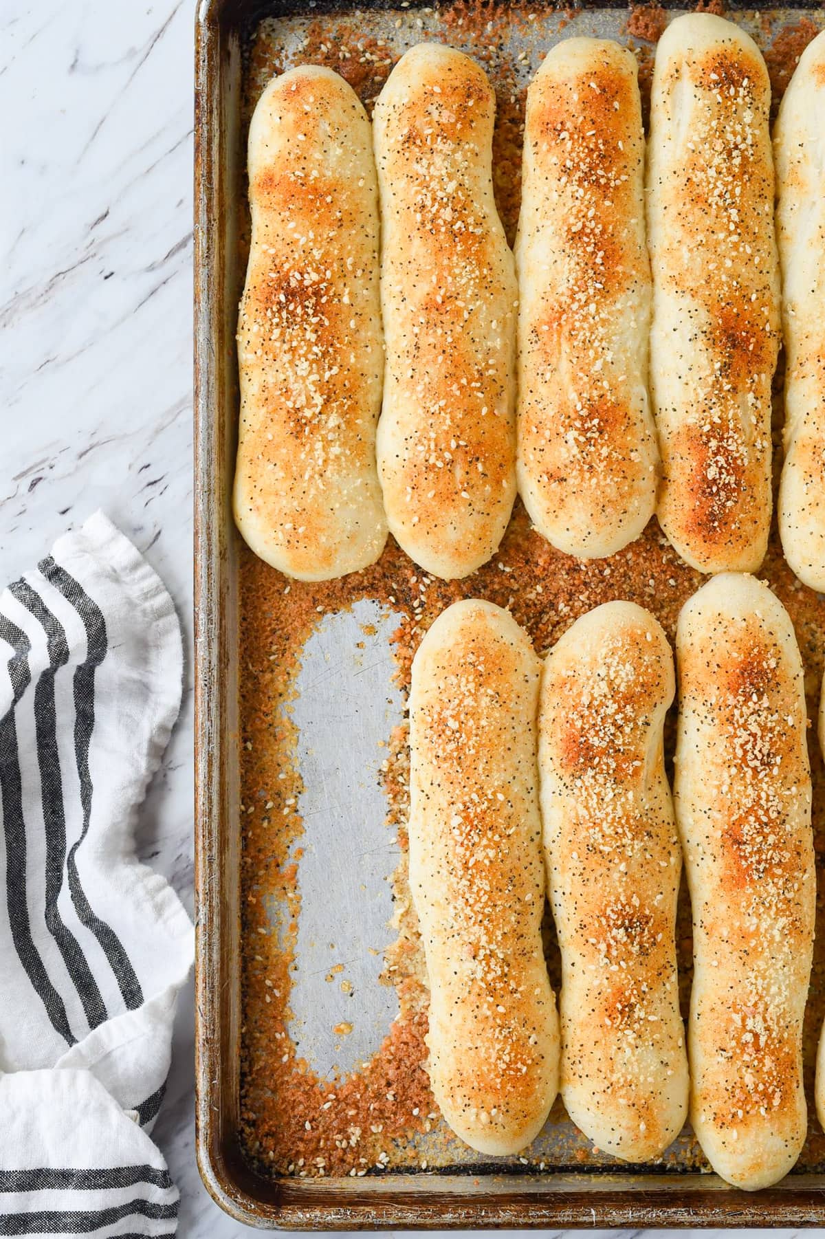 breadsticks on a baking sheet